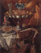 Still life of a wine glass and bottle in a parcel gilt tazza together with a glass decanter on a pewter dish upon a draped tabletop unknow artist